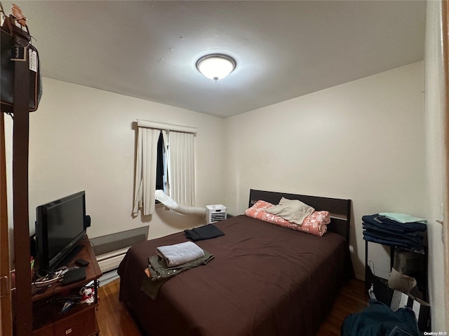 bedroom featuring dark hardwood / wood-style floors