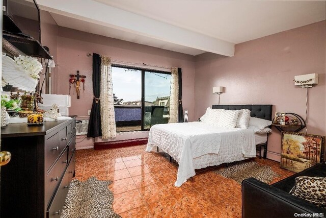 bedroom featuring access to exterior and beam ceiling