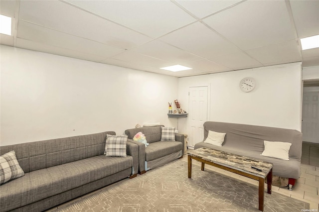 living room with a paneled ceiling