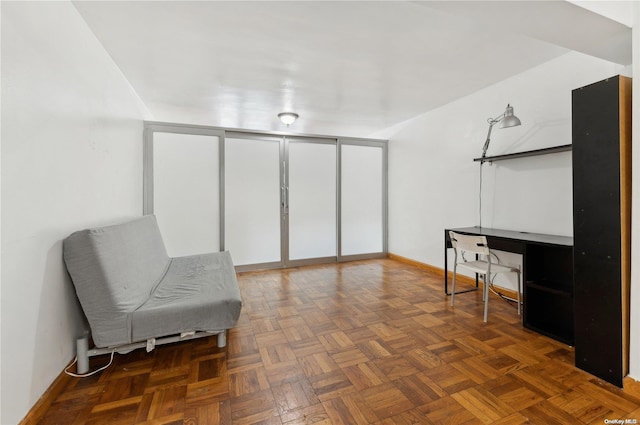 living area with dark parquet floors