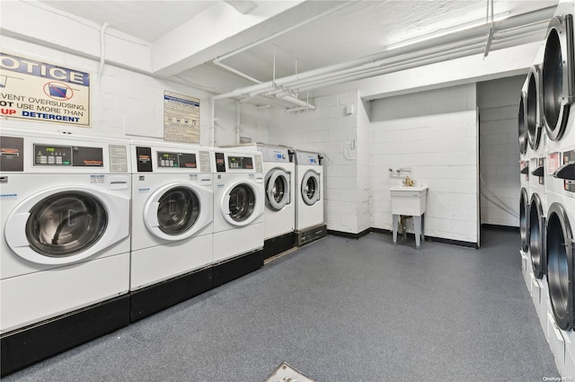 clothes washing area with washing machine and clothes dryer