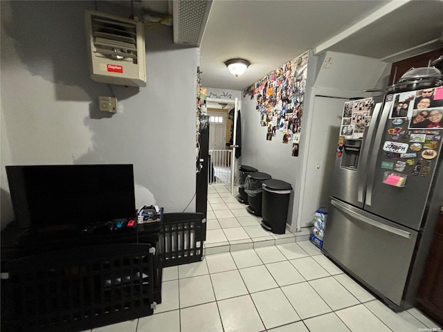 kitchen featuring stainless steel fridge with ice dispenser and light tile patterned floors