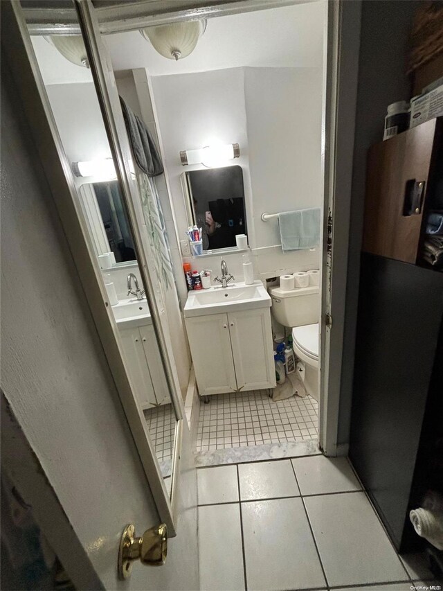 25-37 48th St, Astoria, NY 11103 - bathroom with tile patterned floors, toilet, and vanity