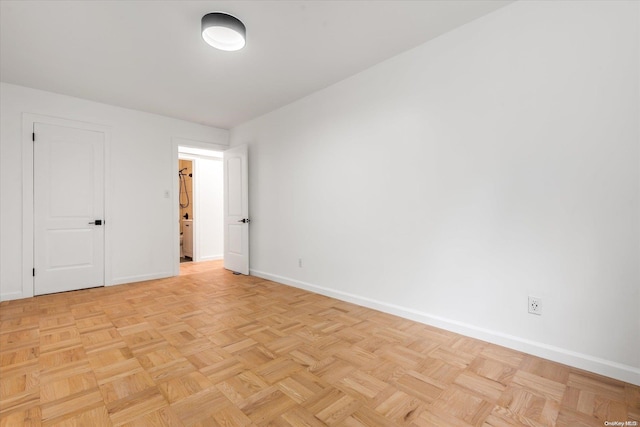 spare room featuring light parquet flooring