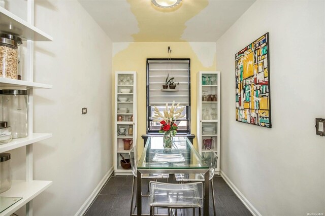 dining space with dark hardwood / wood-style floors