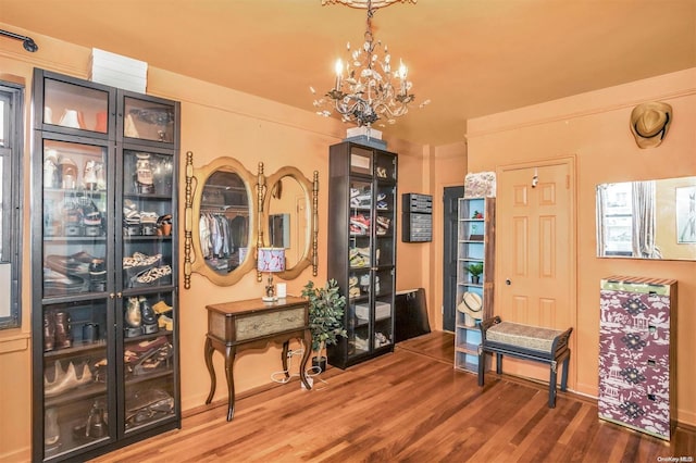 foyer entrance featuring a chandelier and hardwood / wood-style flooring