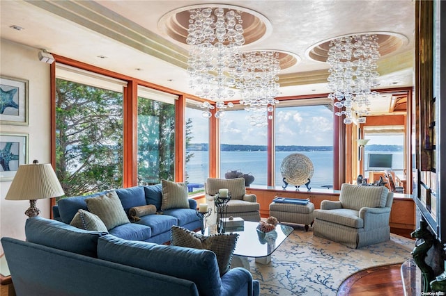 interior space with a tray ceiling and an inviting chandelier