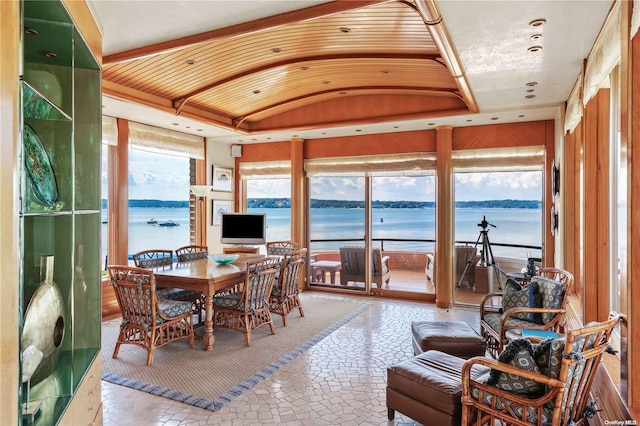 sunroom featuring lofted ceiling and a wealth of natural light