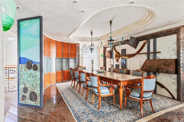 dining room featuring a raised ceiling