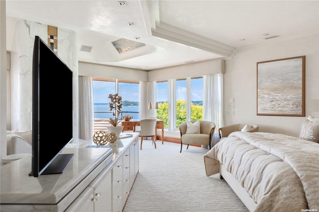 bedroom with light colored carpet and multiple windows