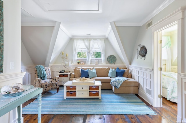 sitting room with crown molding, dark hardwood / wood-style flooring, and vaulted ceiling