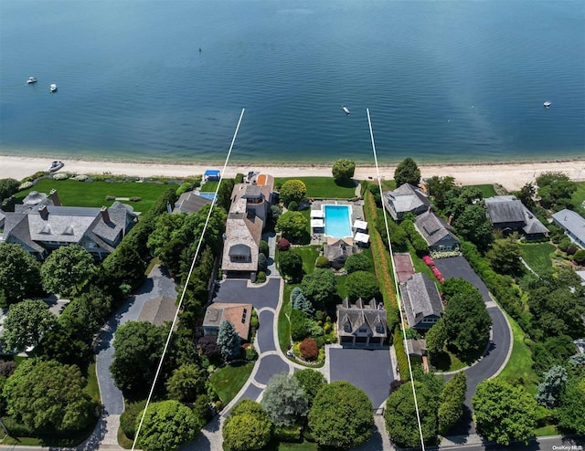 bird's eye view featuring a water view and a view of the beach