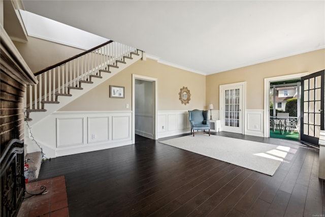 interior space with dark hardwood / wood-style flooring and crown molding