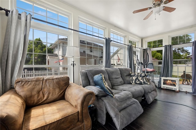 living room featuring ceiling fan, dark hardwood / wood-style flooring, and ornamental molding