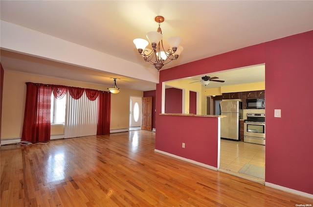 interior space with ceiling fan with notable chandelier, a baseboard heating unit, and light hardwood / wood-style flooring