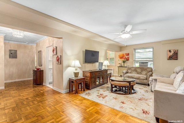 living room featuring ceiling fan, parquet floors, electric panel, cooling unit, and ornamental molding