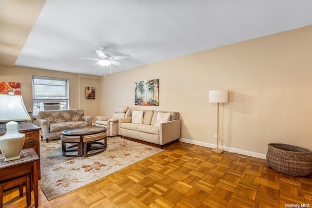 living room featuring parquet flooring, ceiling fan, and cooling unit