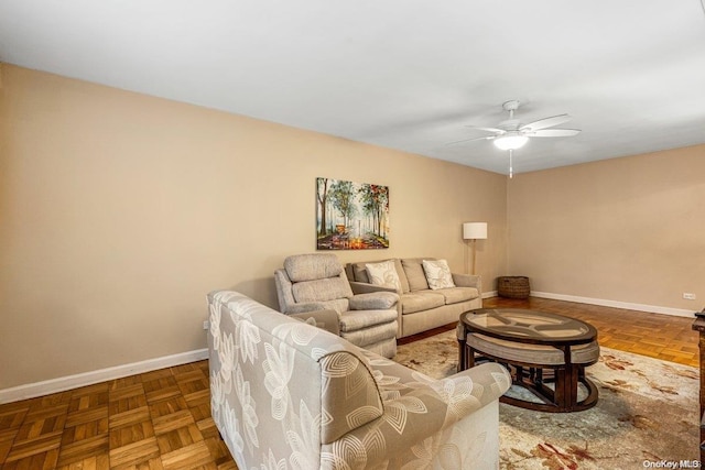 living room with parquet flooring and ceiling fan