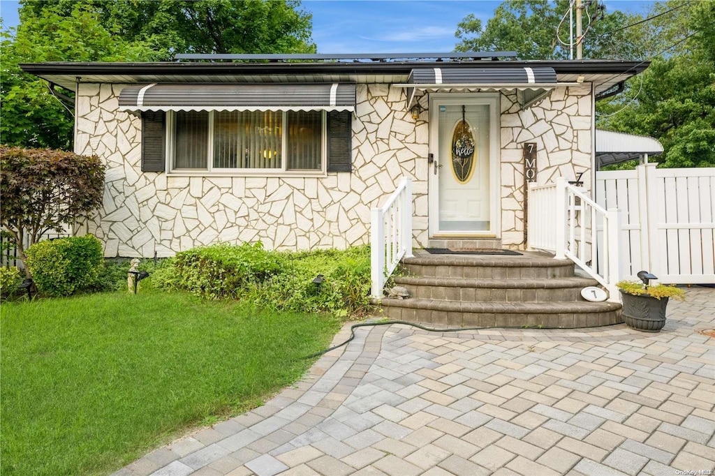 view of front of home with a front yard