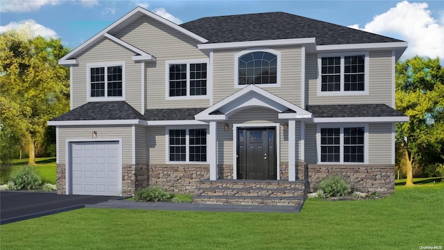 craftsman house with a front yard and a garage