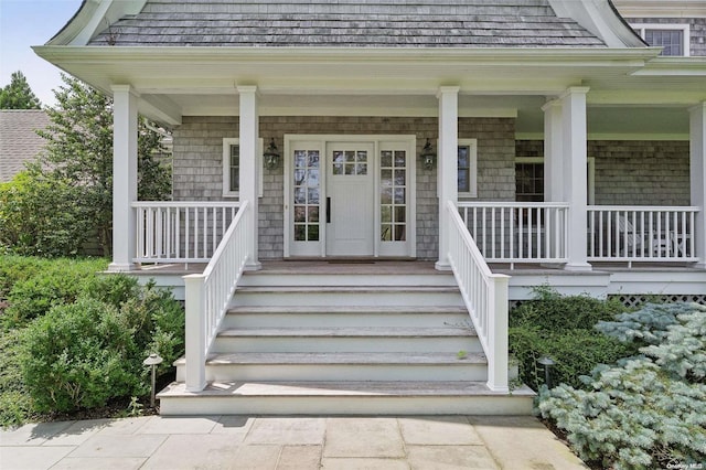 property entrance with covered porch