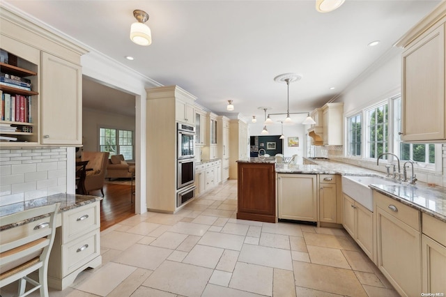 kitchen with sink, hanging light fixtures, tasteful backsplash, kitchen peninsula, and ornamental molding