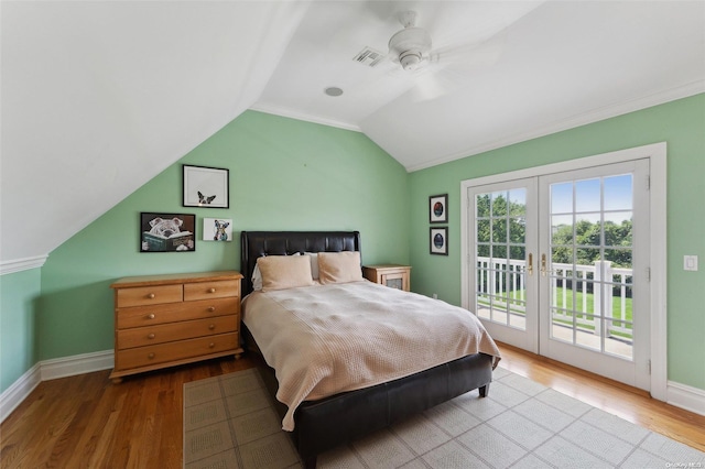 bedroom with ceiling fan, access to exterior, wood-type flooring, and lofted ceiling