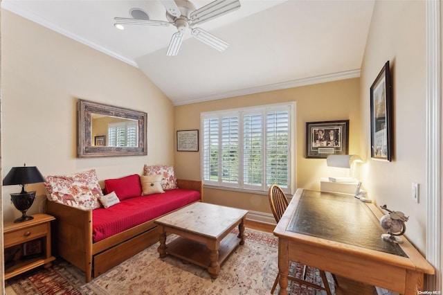 living room featuring hardwood / wood-style flooring, ceiling fan, lofted ceiling, and crown molding