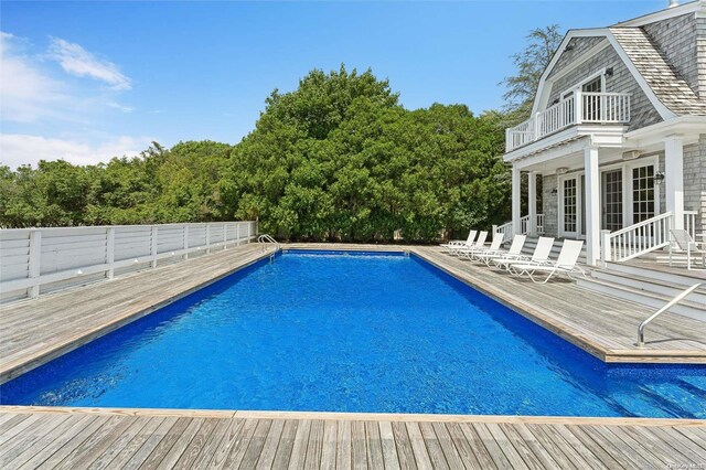 view of swimming pool with a wooden deck