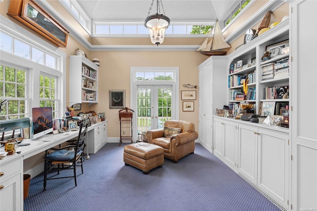 office space with dark colored carpet, a chandelier, a healthy amount of sunlight, and french doors