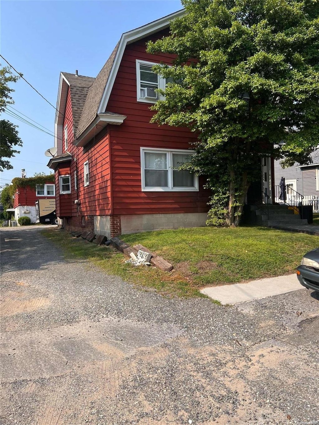 view of home's exterior with a yard