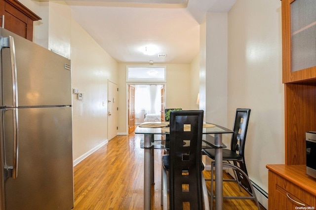 dining space featuring light hardwood / wood-style floors