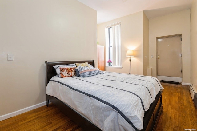 bedroom featuring dark wood-type flooring