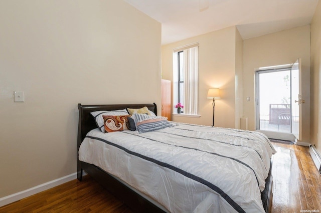 bedroom with dark wood-type flooring