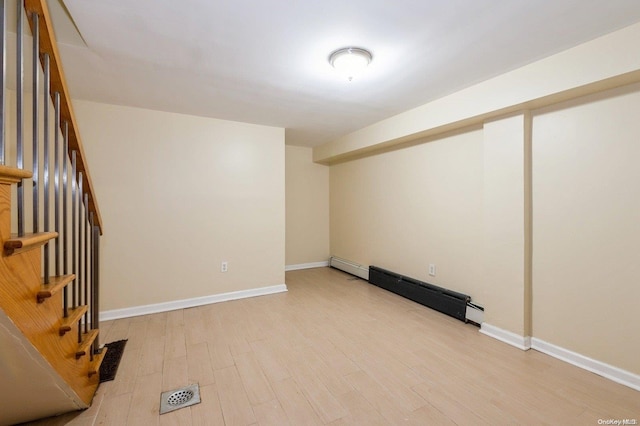 interior space featuring light hardwood / wood-style floors and baseboard heating