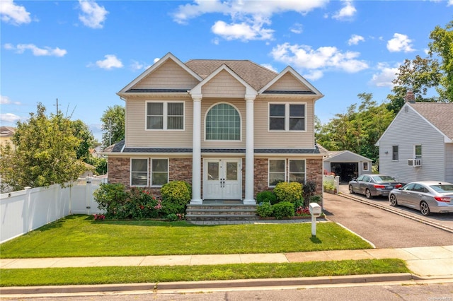 view of front of home with a front lawn