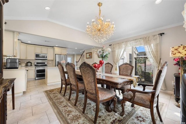 tiled dining area featuring ornamental molding, lofted ceiling, and an inviting chandelier