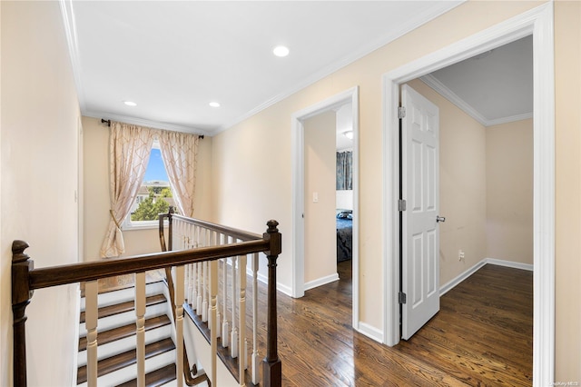 hall with ornamental molding and dark wood-type flooring