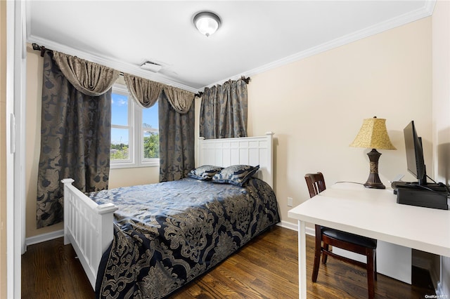 bedroom with dark hardwood / wood-style floors and crown molding