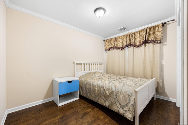 bedroom featuring dark wood-type flooring and ornamental molding