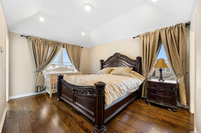 bedroom featuring dark wood-type flooring, lofted ceiling, and ornamental molding