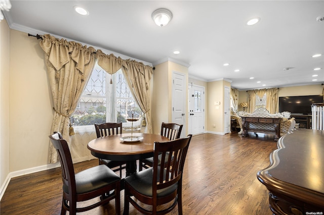 dining space with wood-type flooring and ornamental molding