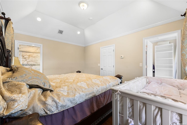 bedroom with crown molding and vaulted ceiling