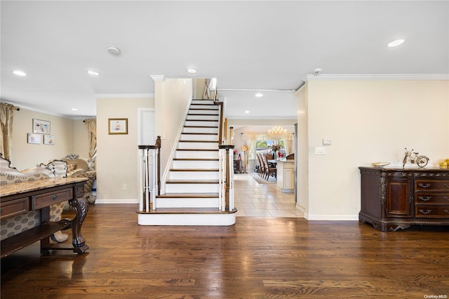 stairs with hardwood / wood-style floors and ornamental molding