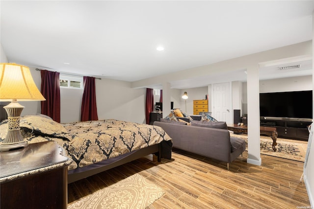 bedroom featuring light wood-type flooring