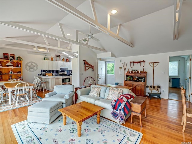 4 Landing Ln, Southampton, NY 11968 - living area with light wood-style floors, ceiling fan, recessed lighting, beamed ceiling, and high vaulted ceiling