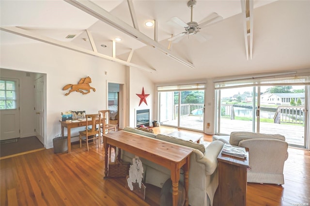 4 Landing Ln, Southampton, NY 11968 - living room featuring a water view, high vaulted ceiling, wood finished floors, a ceiling fan, and recessed lighting