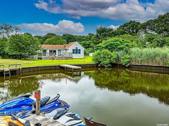 4 Landing Ln, Southampton, NY 11968 - dock area with a deck with water view and a yard
