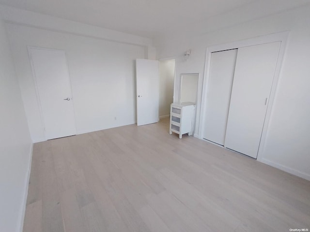 unfurnished bedroom with light hardwood / wood-style floors