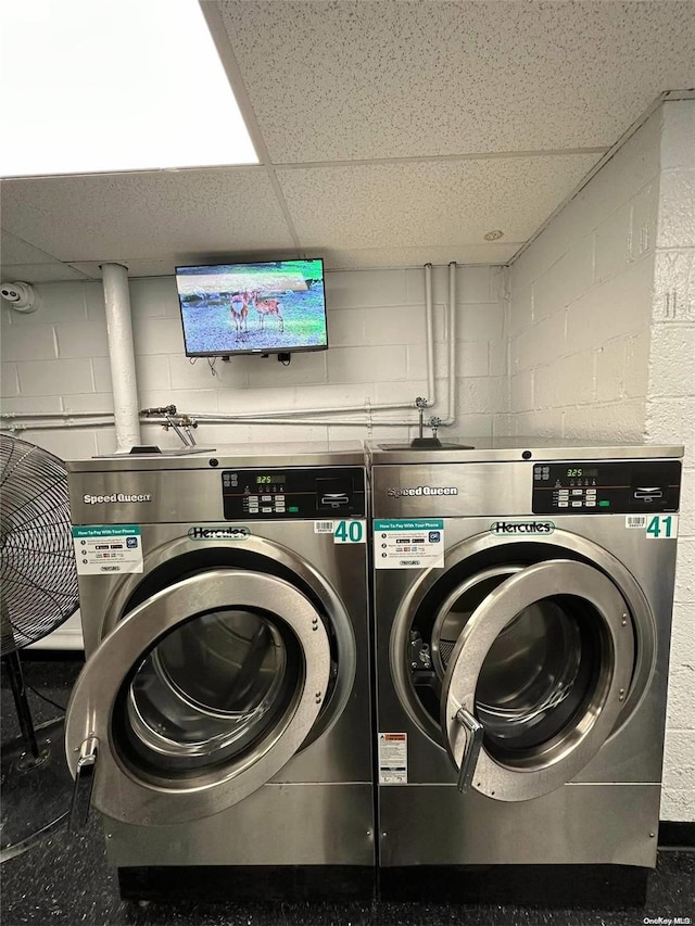 washroom featuring washing machine and dryer